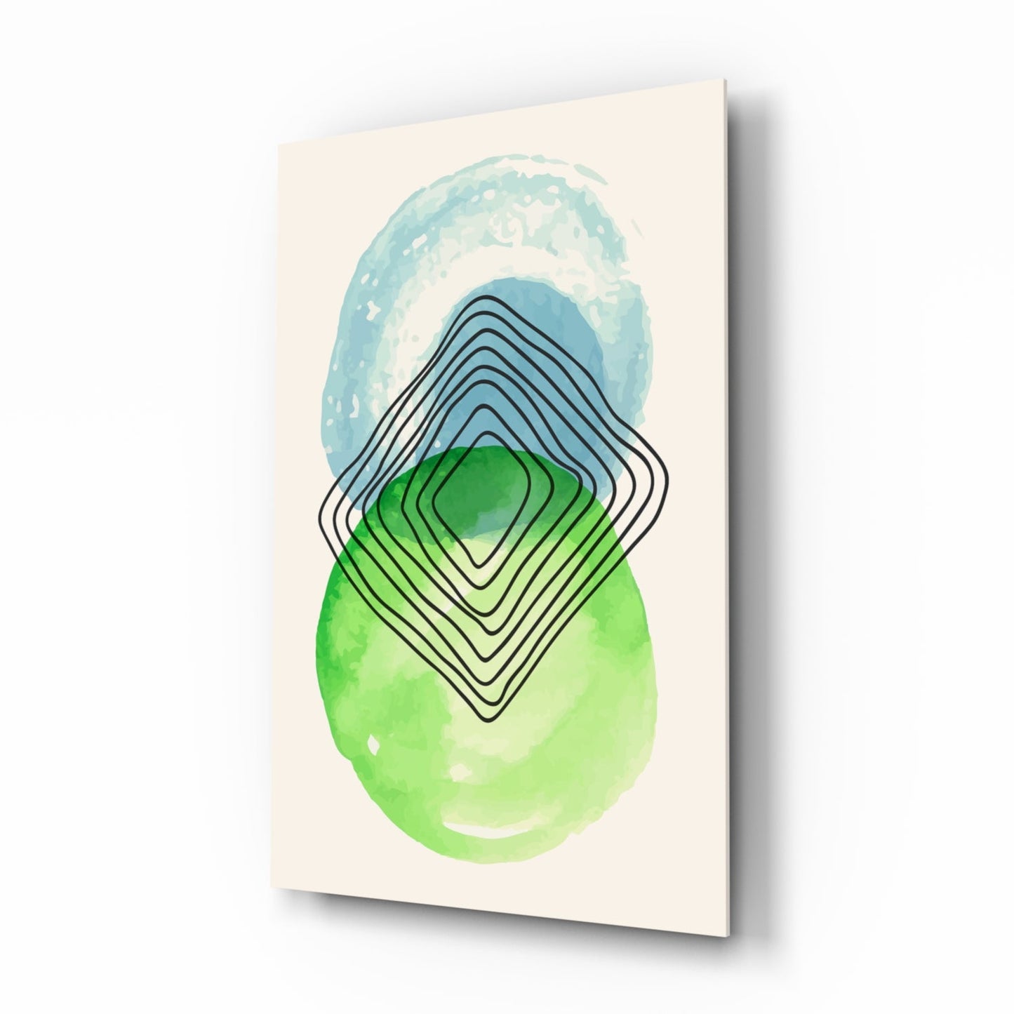 Glass wall art displaying layered geometric shapes in blue, green, and black lines on cream background, angled product view.