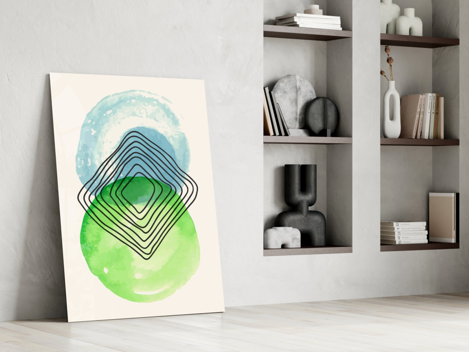 Abstract glass wall art leaning against white wall displaying blue, green, and black concentric geometric shapes with watercolor circles.
