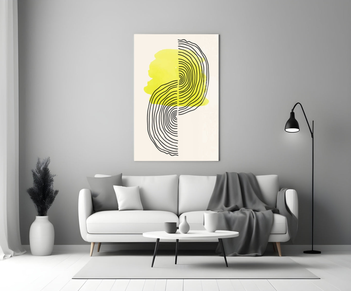 Abstract Sun Glass Wall Art with yellow and black concentric lines displayed above a white sofa in a modern living room.