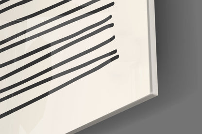 Close-up angled view of white frosted glass with black diagonal striped pattern and beveled edge detail.