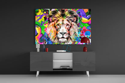 Colorful lion glass wall art displayed above a modern gray media console with white legs and red decorative accessories.
