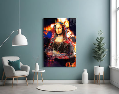 Queen Mona Lisa Glass Wall Art mounted on blue-green wall above white chair in modern interior setting with plants and pendant lamp.