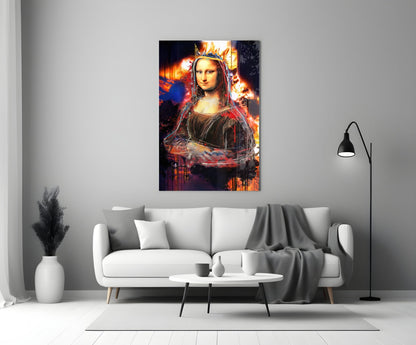 Queen Mona Lisa Glass Wall Art displaying vibrant orange and red flames behind the portrait, mounted above a white sofa in a modern living room.