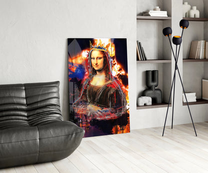 Queen Mona Lisa glass wall art with fiery orange and blue flames displayed in modern living room beside gray sofa.