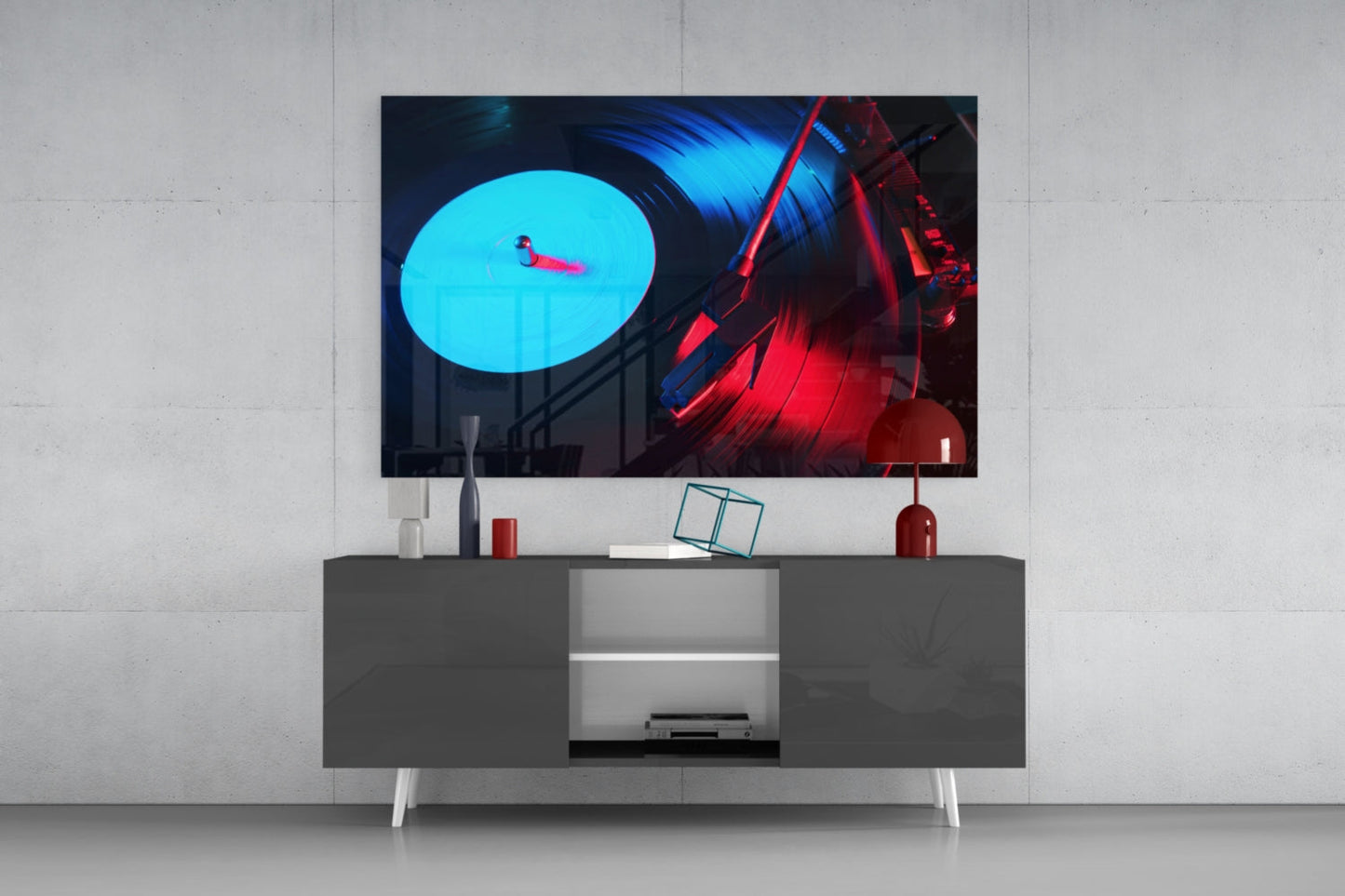 Modern TV setup displaying vibrant blue and red neon gramophone artwork on wall-mounted media console.
