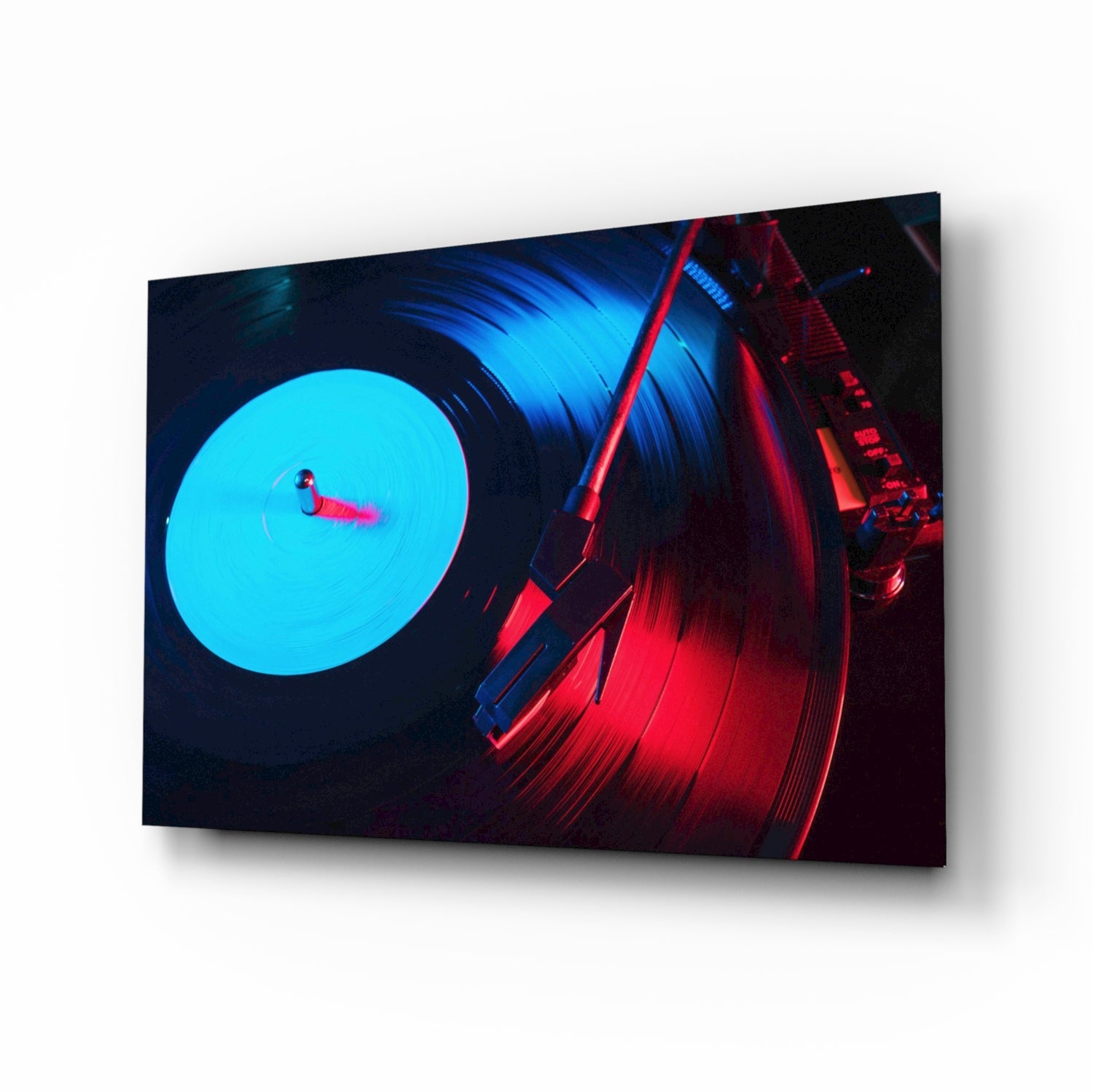 Angled perspective view of glass wall art featuring a turntable with cyan-lit record and red tonearm against dark background.