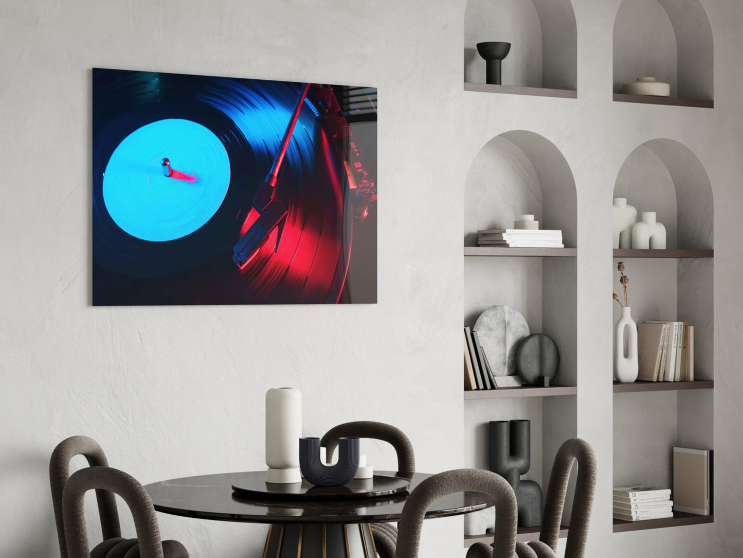 Gramophone glass wall art displaying glowing cyan vinyl record and red headphones mounted above modern dining table with chairs.