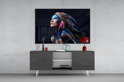 Red dome pendant lamp displayed on modern gray media console beneath wall-mounted TV showing portrait artwork.