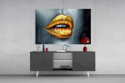 Golden lips glass wall art displayed above a modern media console in a contemporary living room setting.