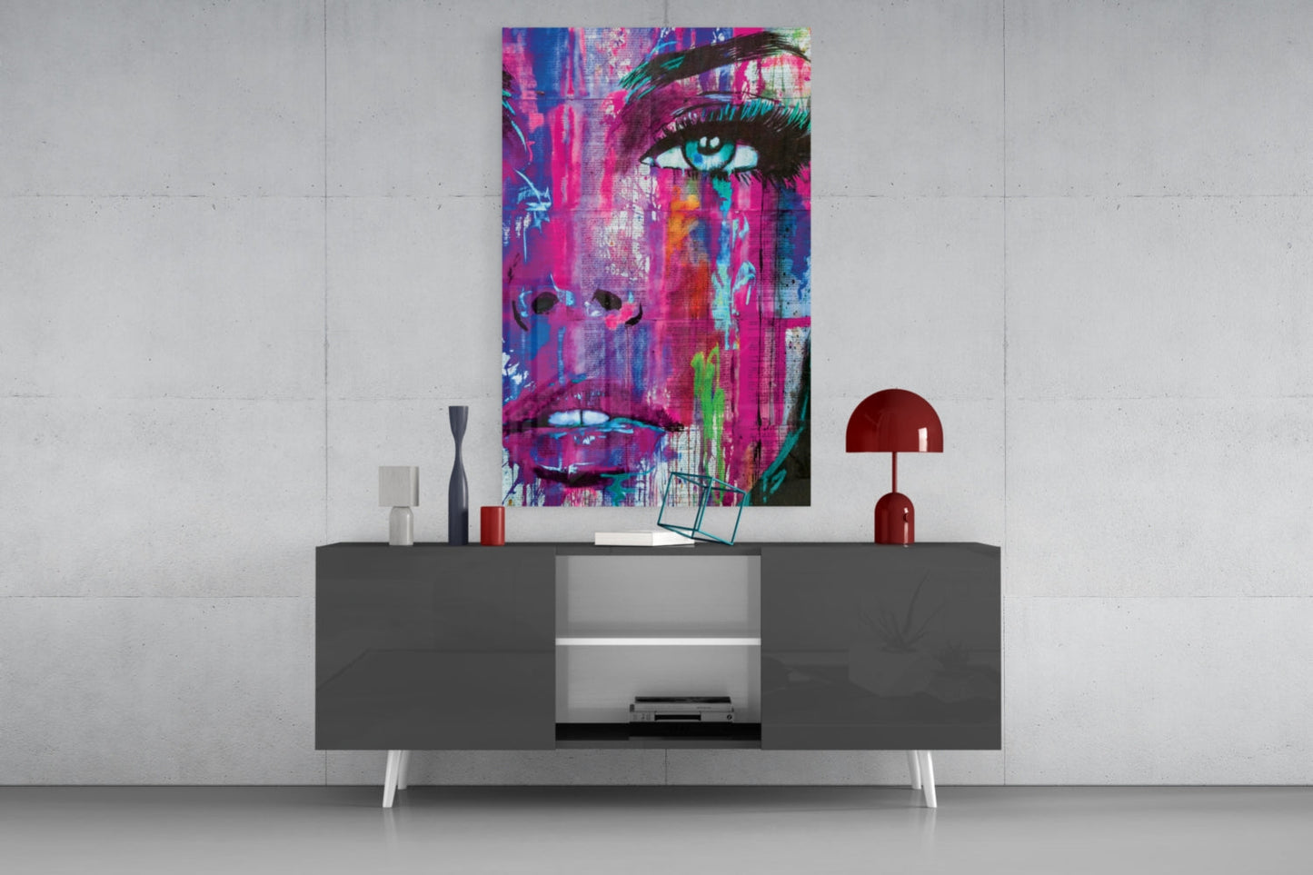 Vibrant pop art portrait with magenta, blue, and neon colors displayed above a modern gray console table with white legs.