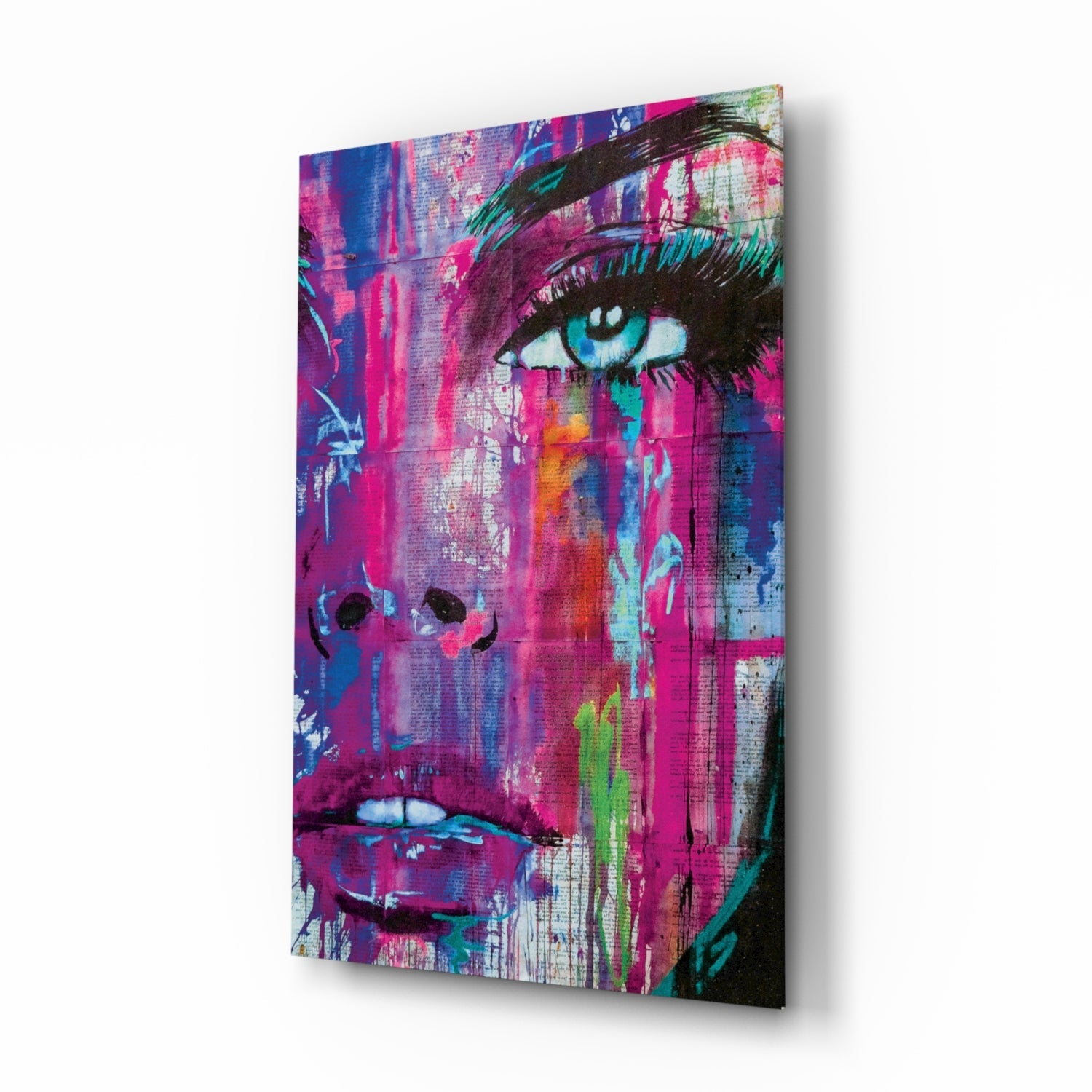 Vibrant pop art canvas featuring a woman's face with blue eyes and magenta tones, displayed at an angle showing depth and shadow.
