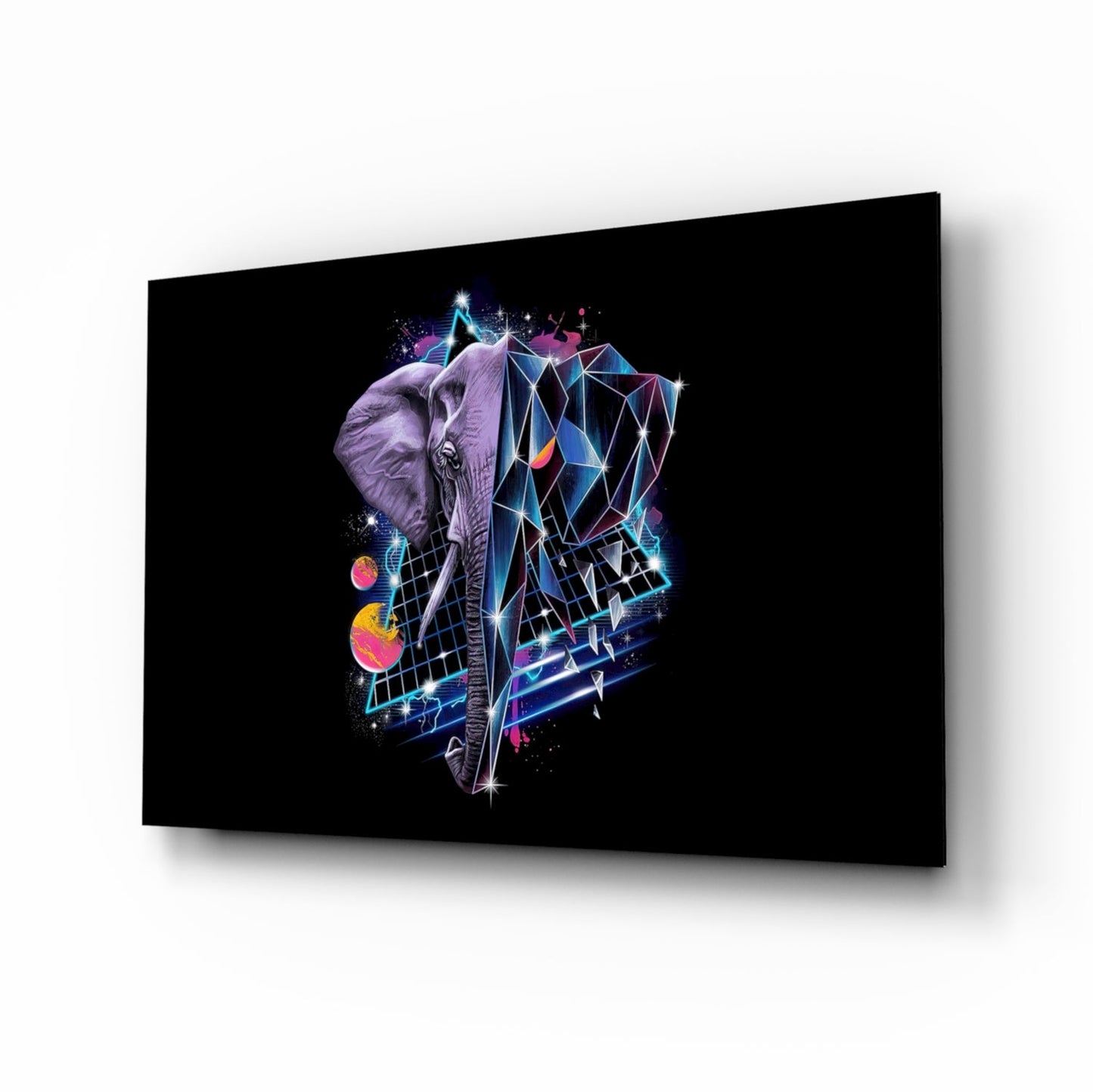 Angled perspective view of black glass wall art displaying a neon-outlined elephant head with colorful geometric patterns and glowing planets against dark background.