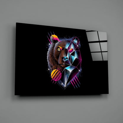 Angled view of black glass wall art displaying a neon-colored bear head with geometric patterns and glowing cyan, magenta, and yellow accents.