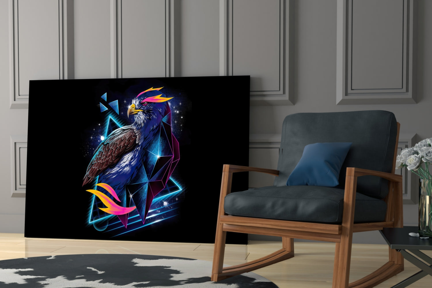 Diamond Hawk Glass Wall Art displayed in modern living room next to wooden chair, featuring neon eagle design with blue, pink, and gold geometric elements on black background.