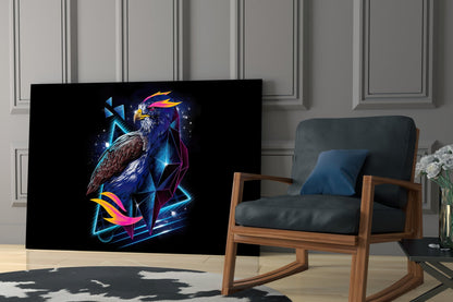 Diamond Hawk Glass Wall Art displayed in modern living room next to wooden chair, featuring neon eagle design with blue, pink, and gold geometric elements on black background.