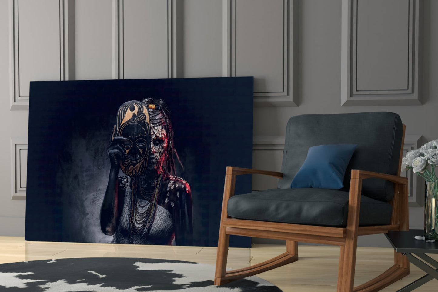 Dark glass wall art displaying a figure in an ornate black mask with red accents, displayed in a modern living room setting beside a wooden chair.