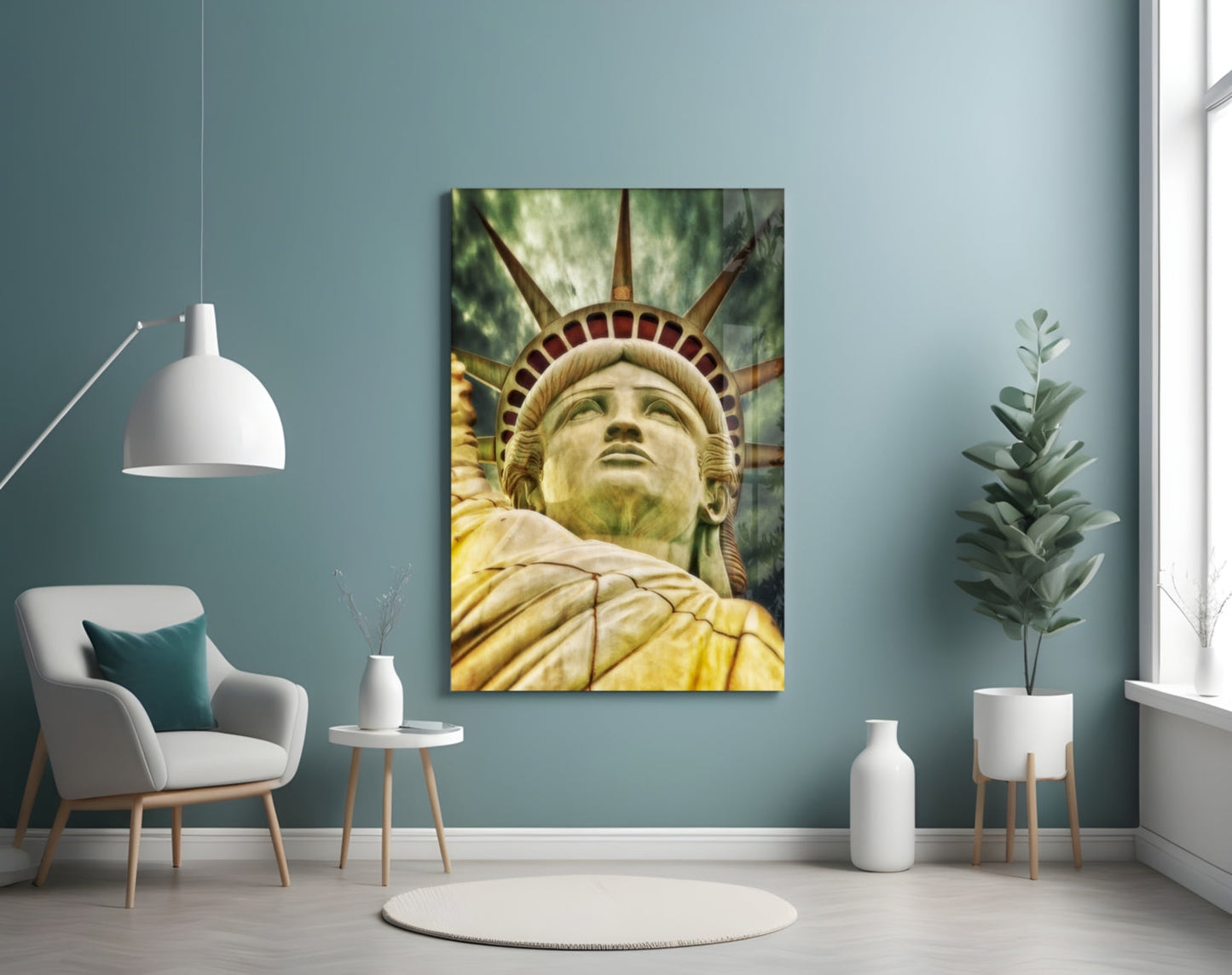 Statue of Liberty glass wall art displayed in a modern room with teal walls, white furniture, and potted plants.
