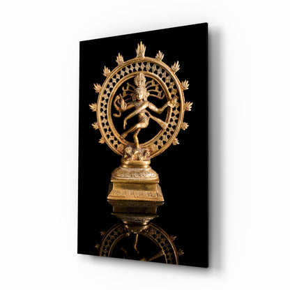 Gold Shiva Nataraja statue on black glass mounted at an angle, showing the dancing figure within ornate circular frame and decorative base.