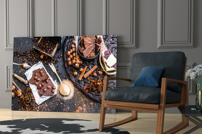 Chocolate glass wall art displaying cocoa beans, chocolate pieces, cinnamon sticks, and spices on dark surface, installed in modern room setting.
