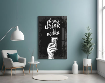 Black canvas vodka wall art with white hand-holding-glass illustration and cursive text displayed in modern teal room setting.