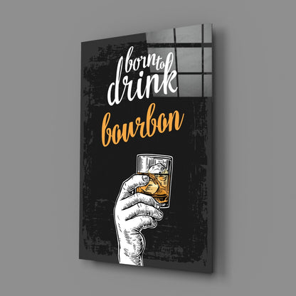Black canvas wall art with white hand holding bourbon glass, white cursive text reading "born to drink" and yellow text reading "bourbon" against distressed background.