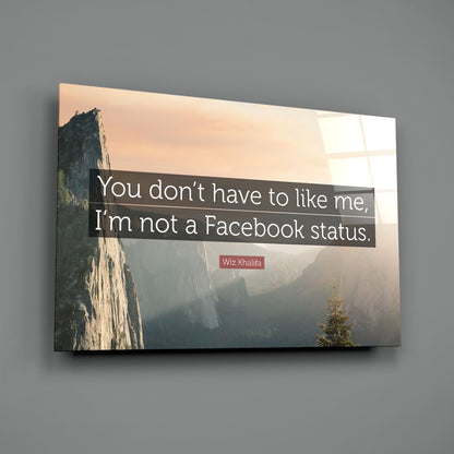 Glass wall art displaying a misty mountain valley landscape with a quote by Wiz Khalifa in white text on a dark overlay.