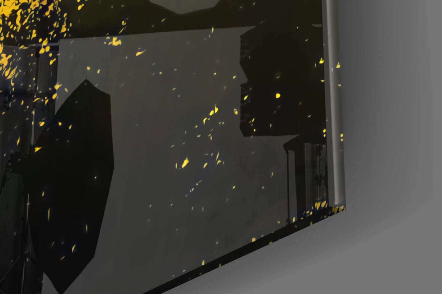 Black glass wall art panel with yellow and gold shattering effect design, installed on light gray wall, angled perspective view.