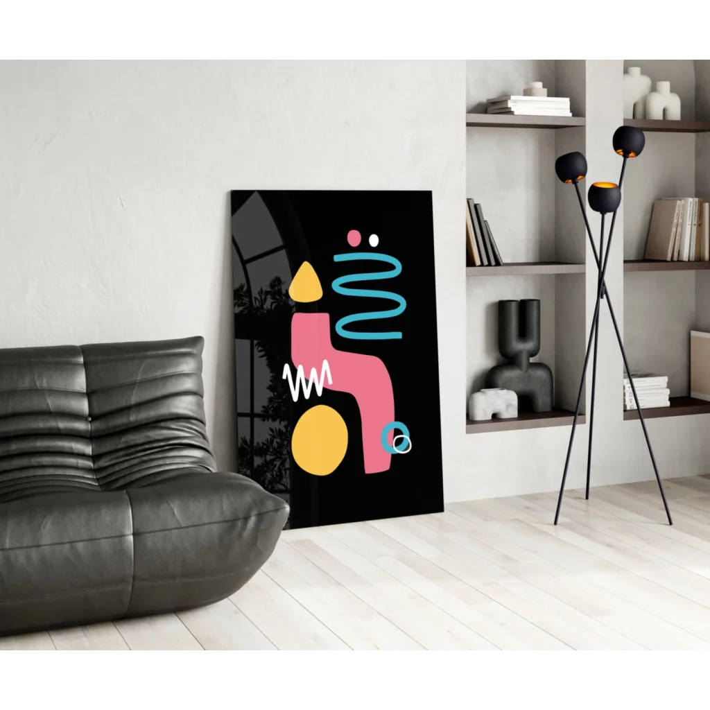 Black abstract glass wall art with pink, yellow, teal geometric shapes
