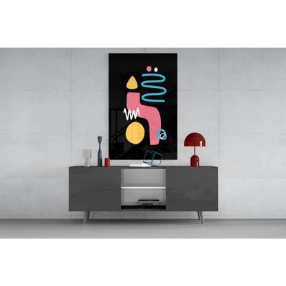 Vibrant glass wall art with pink, yellow, teal geometric shapes on black