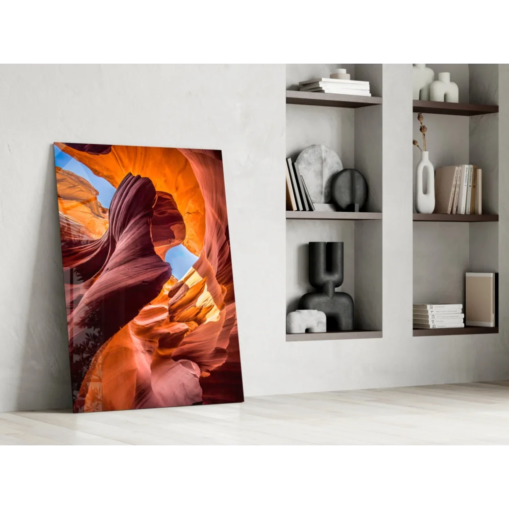 Vibrant orange red canyon glass wall art leaning on white wall