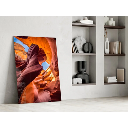 Vibrant orange red canyon glass wall art leaning on white wall
