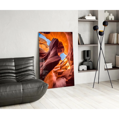 Fiery orange and red glass wall art of canyon wall against white backdrop