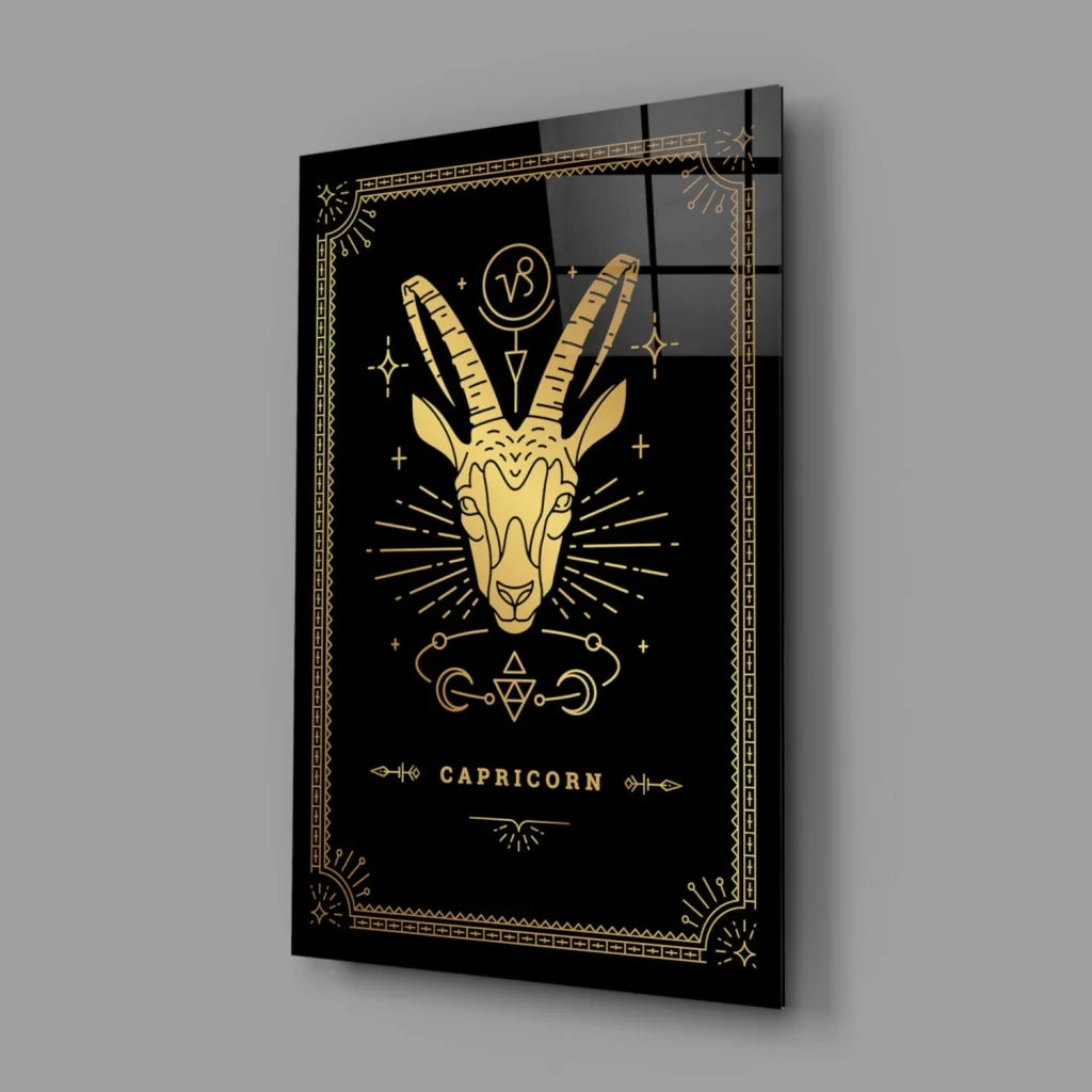 Black gold Capricorn glass wall art with geometric starburst design