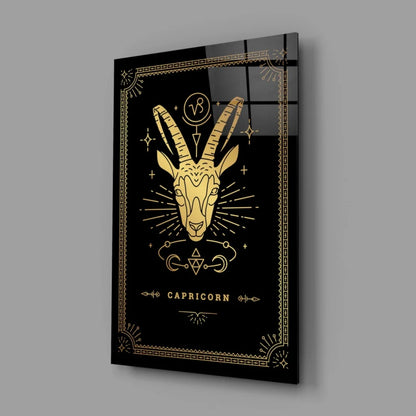 Black gold Capricorn glass wall art with geometric starburst design