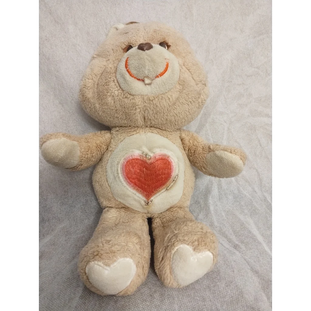Vintage 1983 Care Bears Tenderheart Bear plush with heart belly design