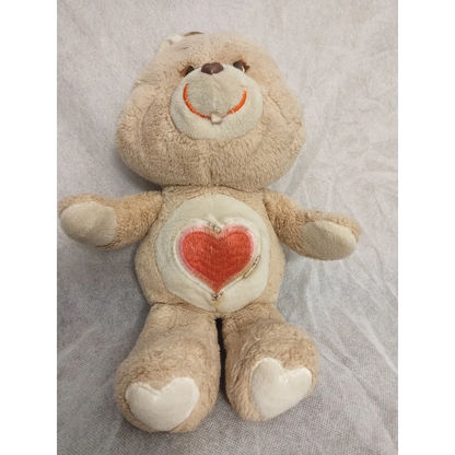 Vintage 1983 Care Bears Tenderheart Bear plush with heart belly design