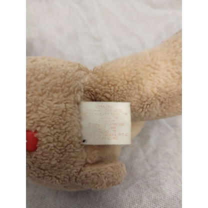 Vintage 1983 Care Bears Tenderheart Bear plush with red heart paw