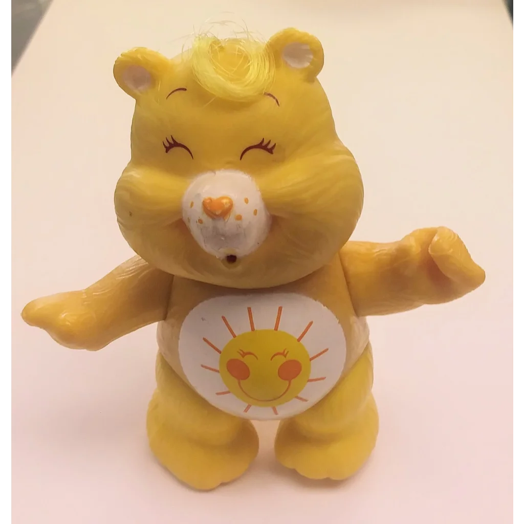 Vintage 1983 Funshine Bear PVC figure, yellow Care Bears toy with sun belly design