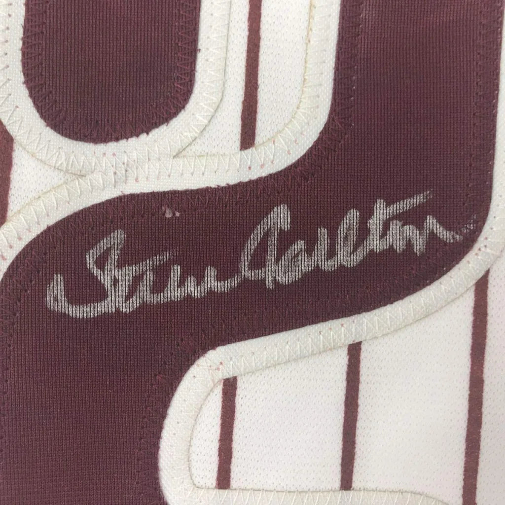 Maroon and white Carlton autographed baseball jersey framed and ready to hang