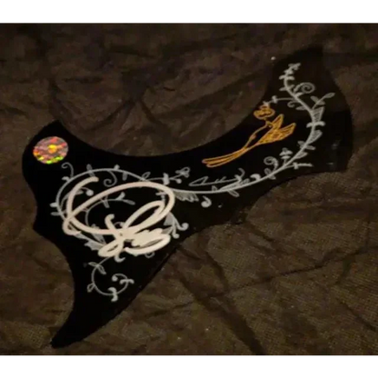 Carrie Underwood signed pick guard with black floral design and gold bird detail