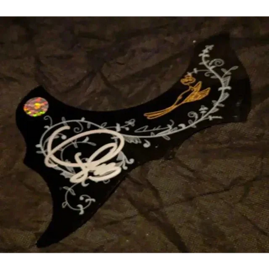 Carrie Underwood signed pick guard with black floral design and gold bird detail