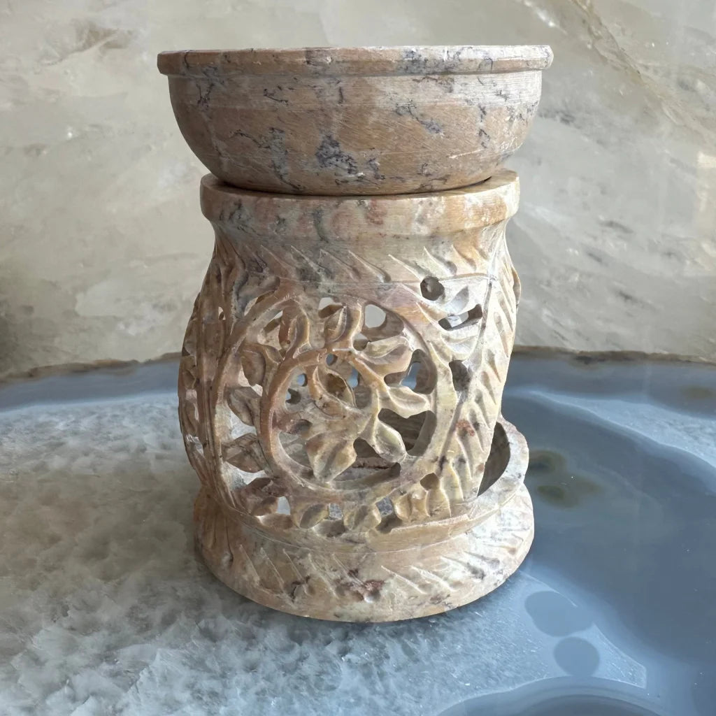 Carved soapstone essential oil burner with floral lattice design