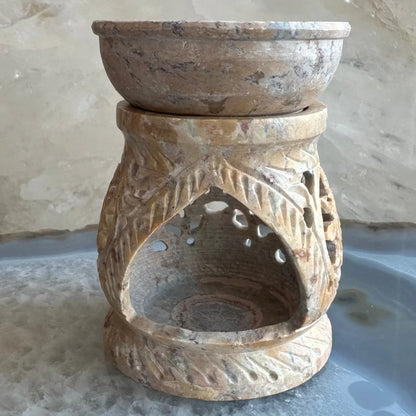 Carved soapstone essential oil burner with floral leaf motifs