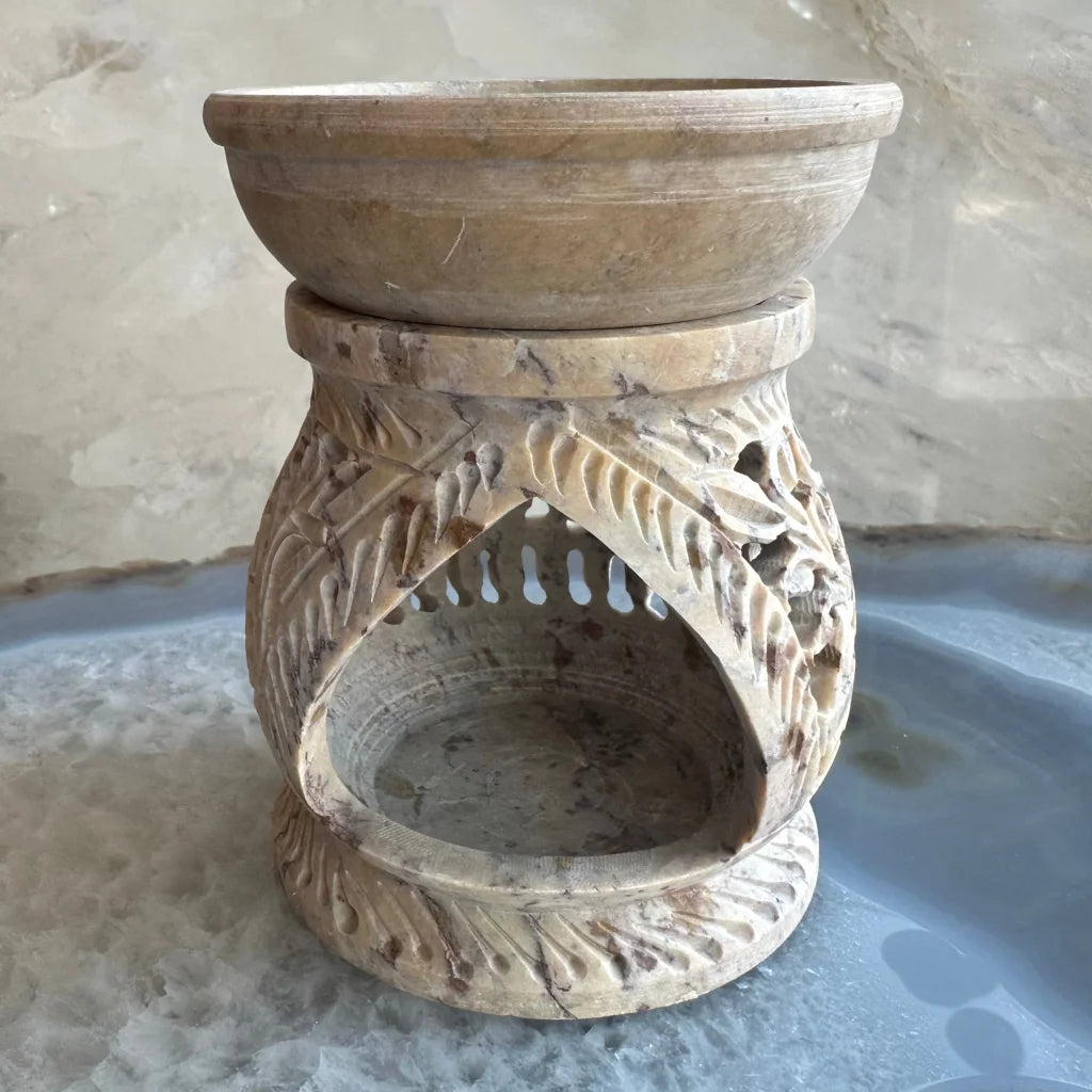 Carved soapstone essential oil burner with floral lattice design