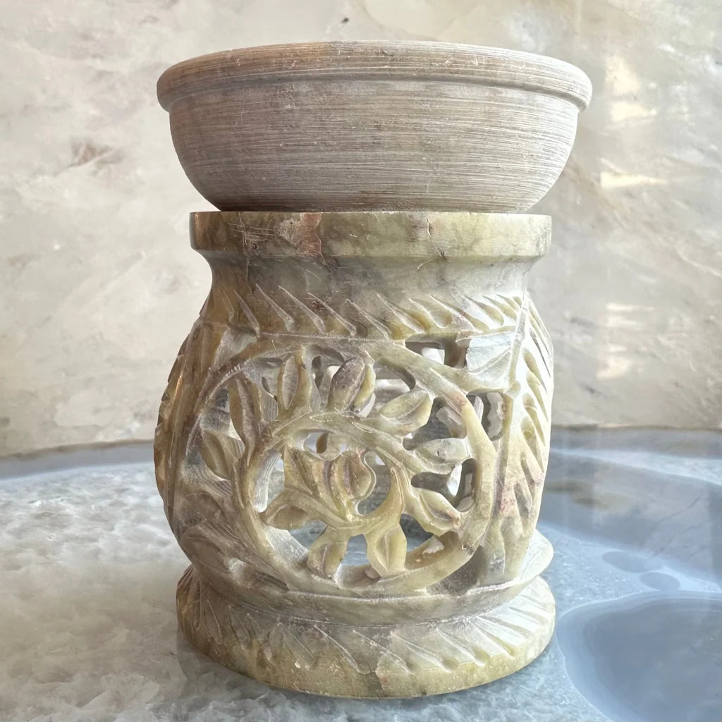 Carved soapstone essential oil burner with leaf vine patterns