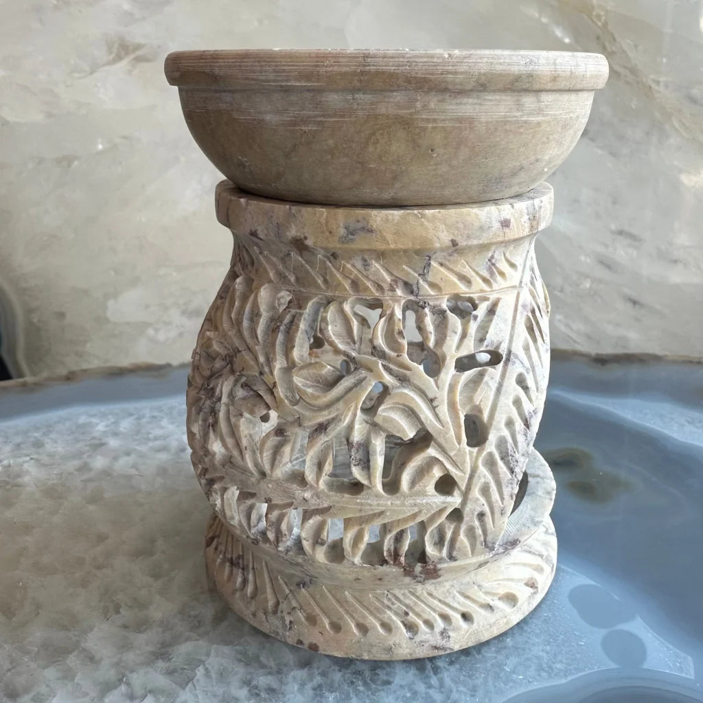 Carved soapstone essential oil burner with floral lattice and leaf patterns
