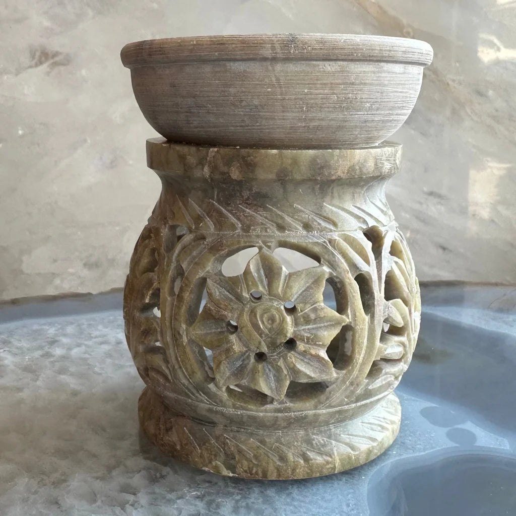 Carved soapstone essential oil burner with floral lattice design