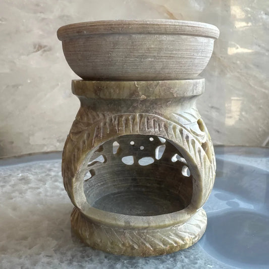 Carved soapstone essential oil burner with floral lattice design