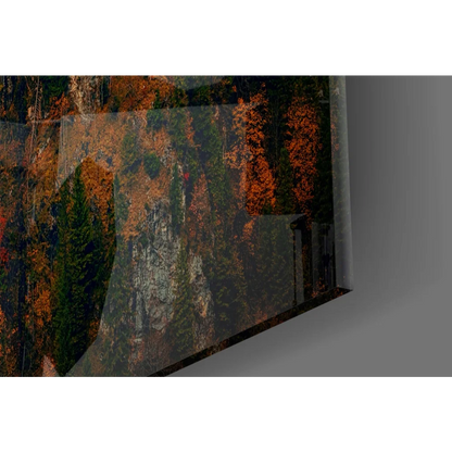 Vibrant autumn glow glass wall art of Neuschwanstein Castle forest scene