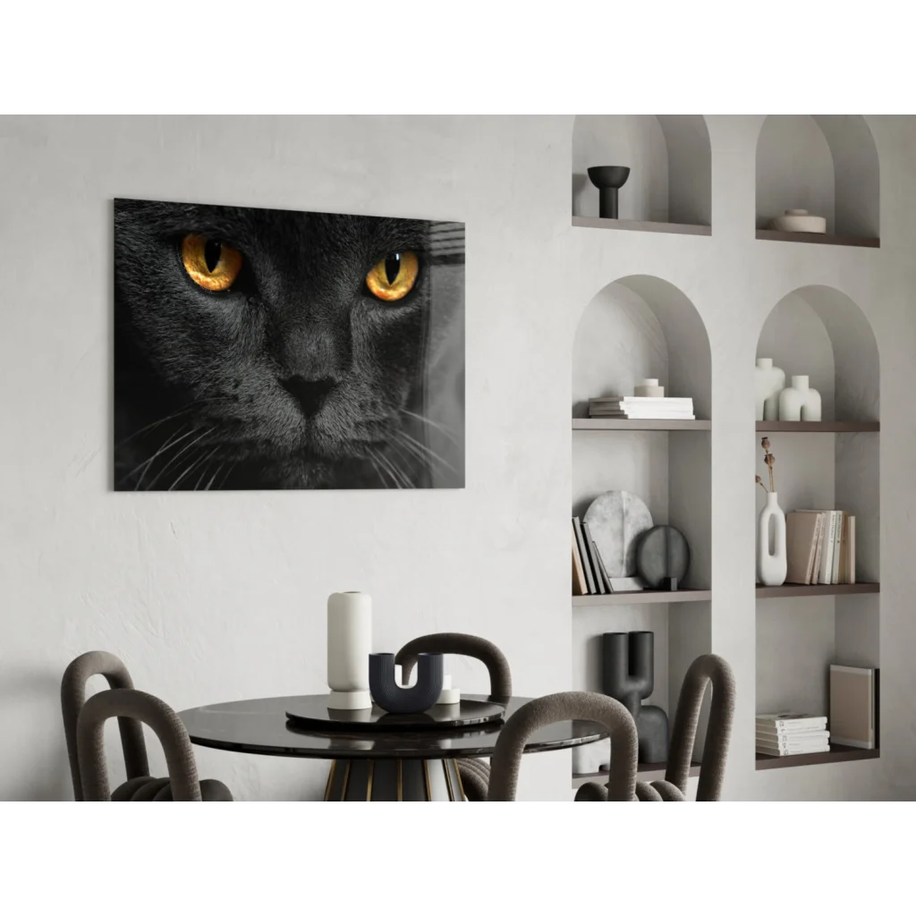 Striking black cat glass wall art with vivid golden eyes close-up